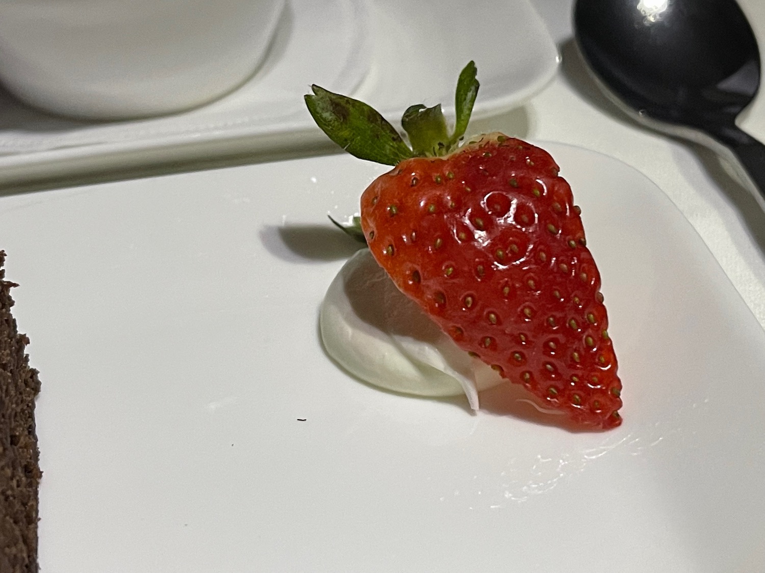 a strawberry on a plate