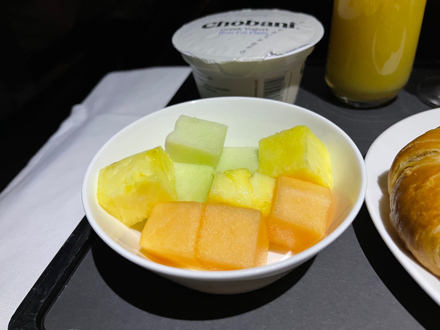 a bowl of fruit on a table