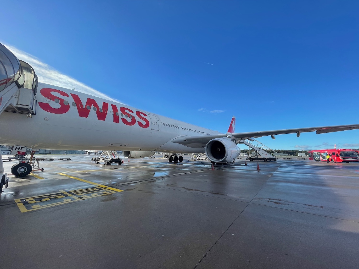 a large white airplane with red writing on it