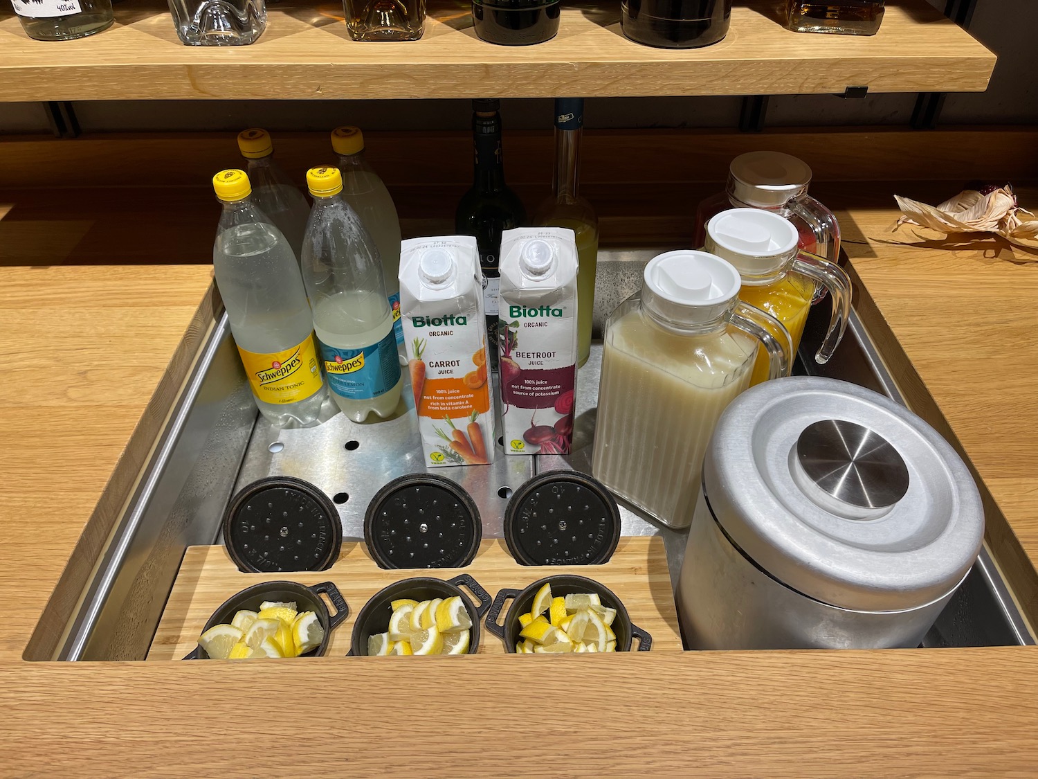 a shelf with a variety of beverages