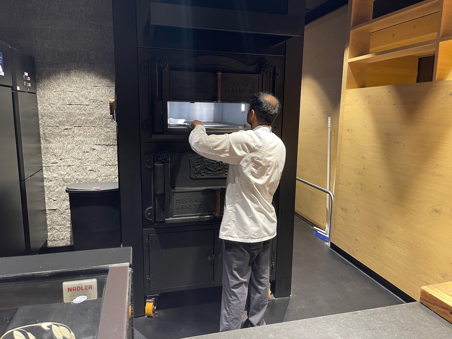 a man opening an oven