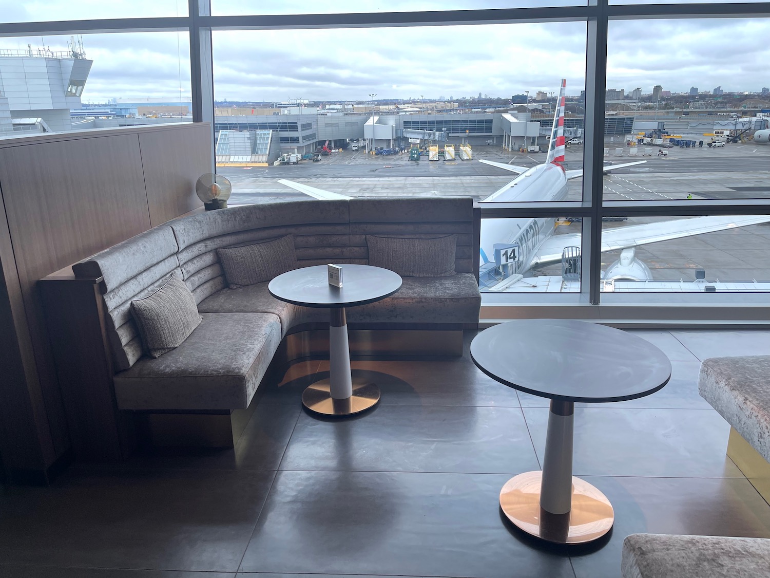 a table and chairs in a room with a window