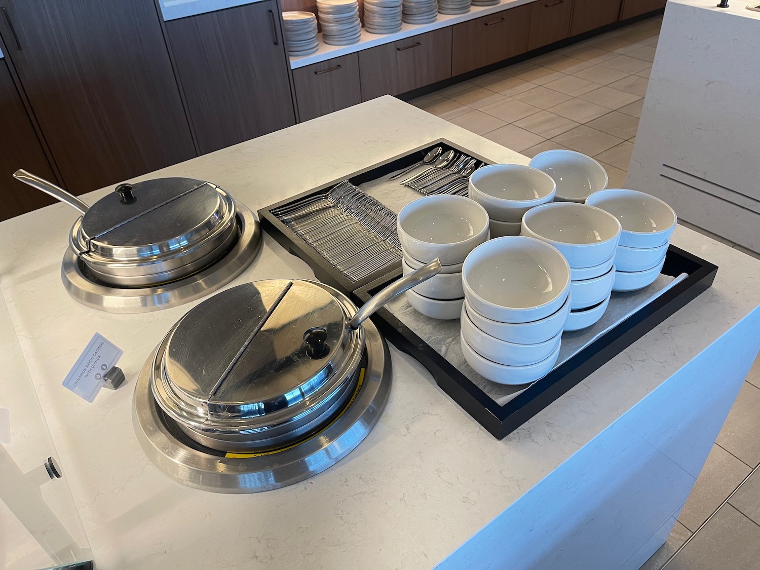 a group of white bowls on a counter