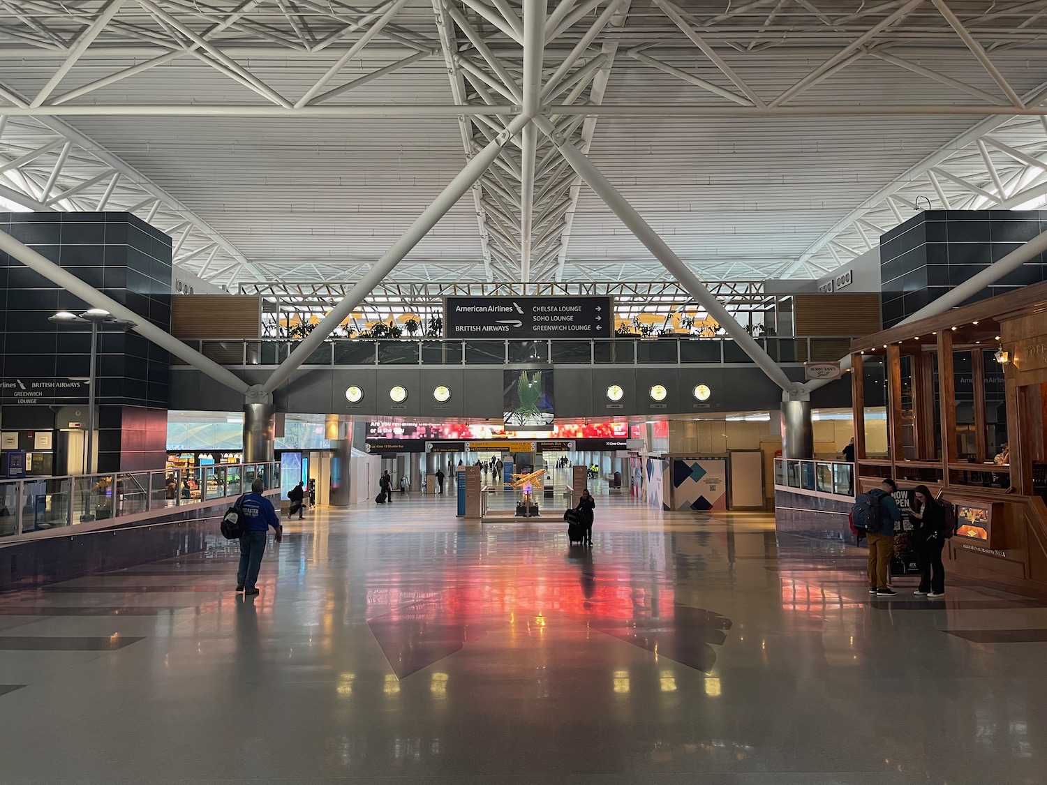 people walking in a large airport