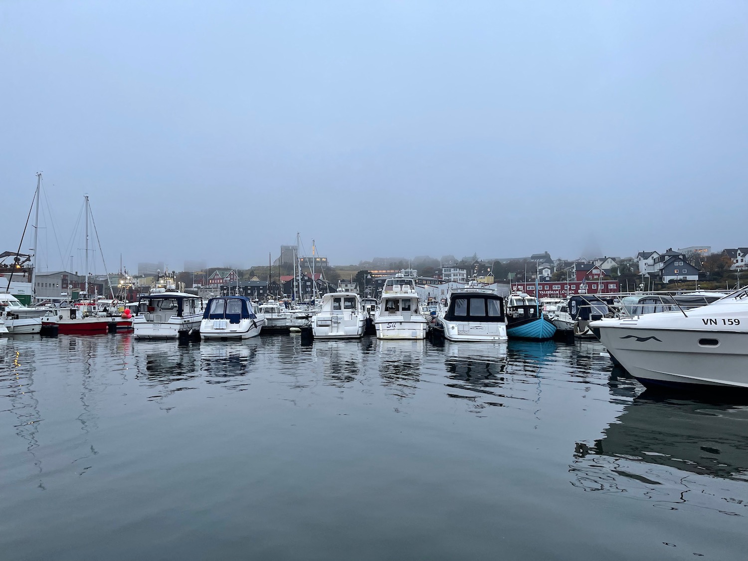 a group of boats in a harbor