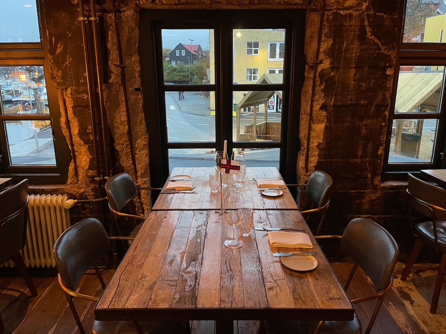 a table with chairs and a window