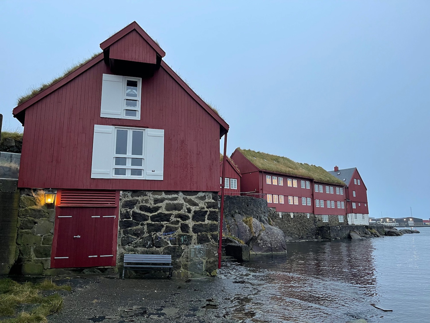 a red building next to water with Motif Number 1 in the background