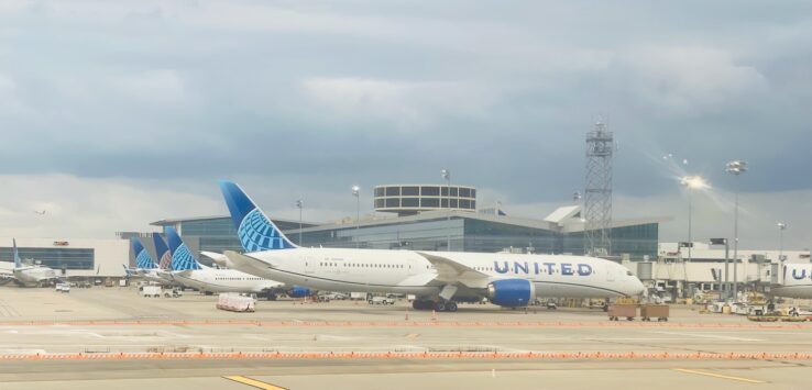 a group of airplanes on a runway