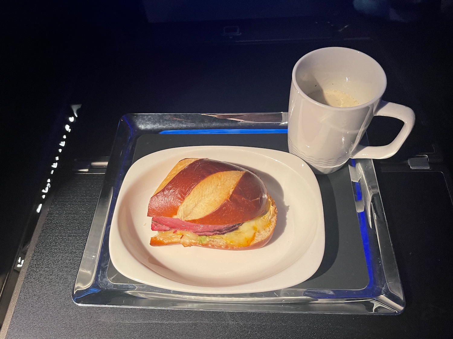 a sandwich and a cup on a tray