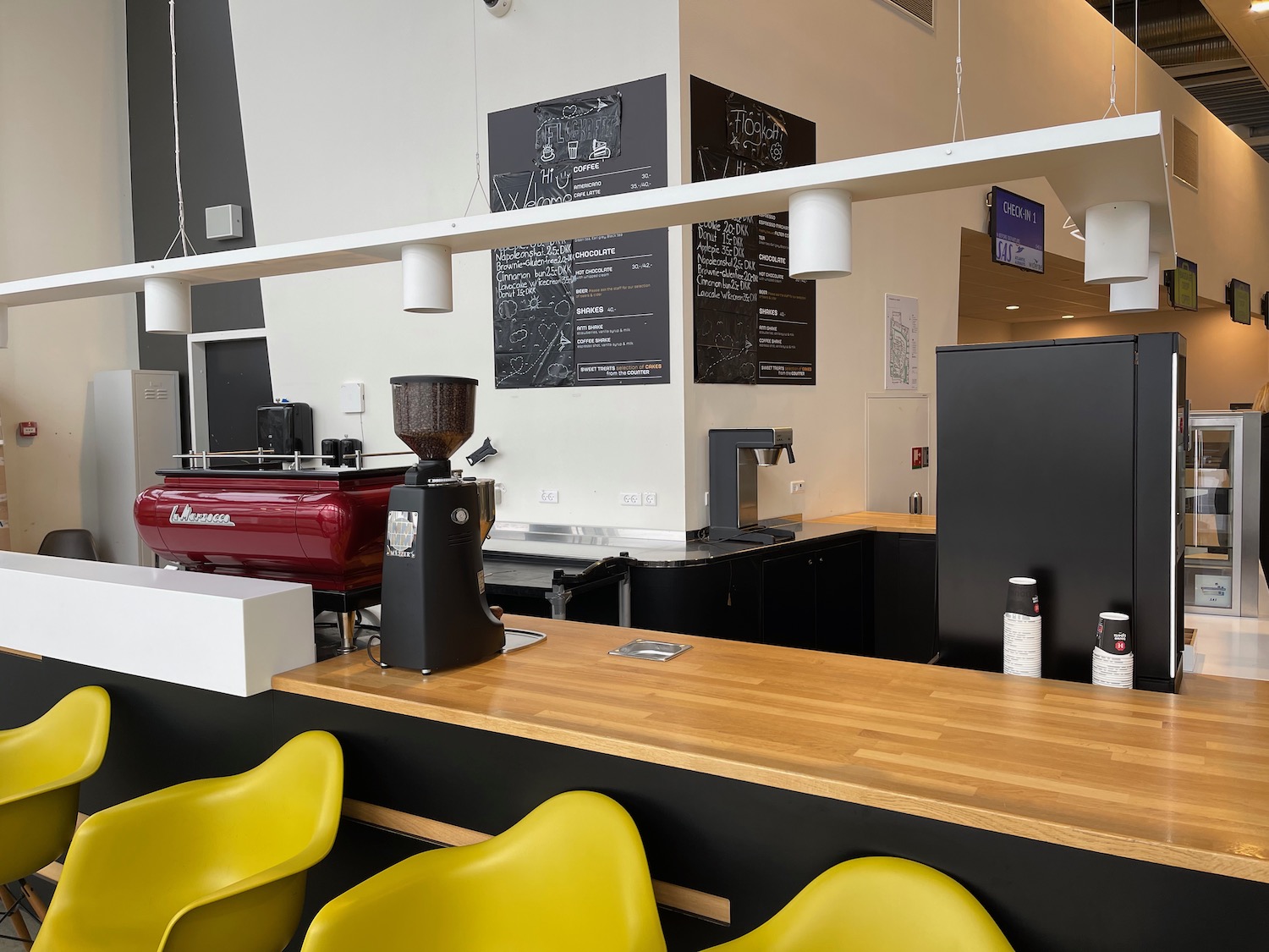 a coffee shop with yellow chairs