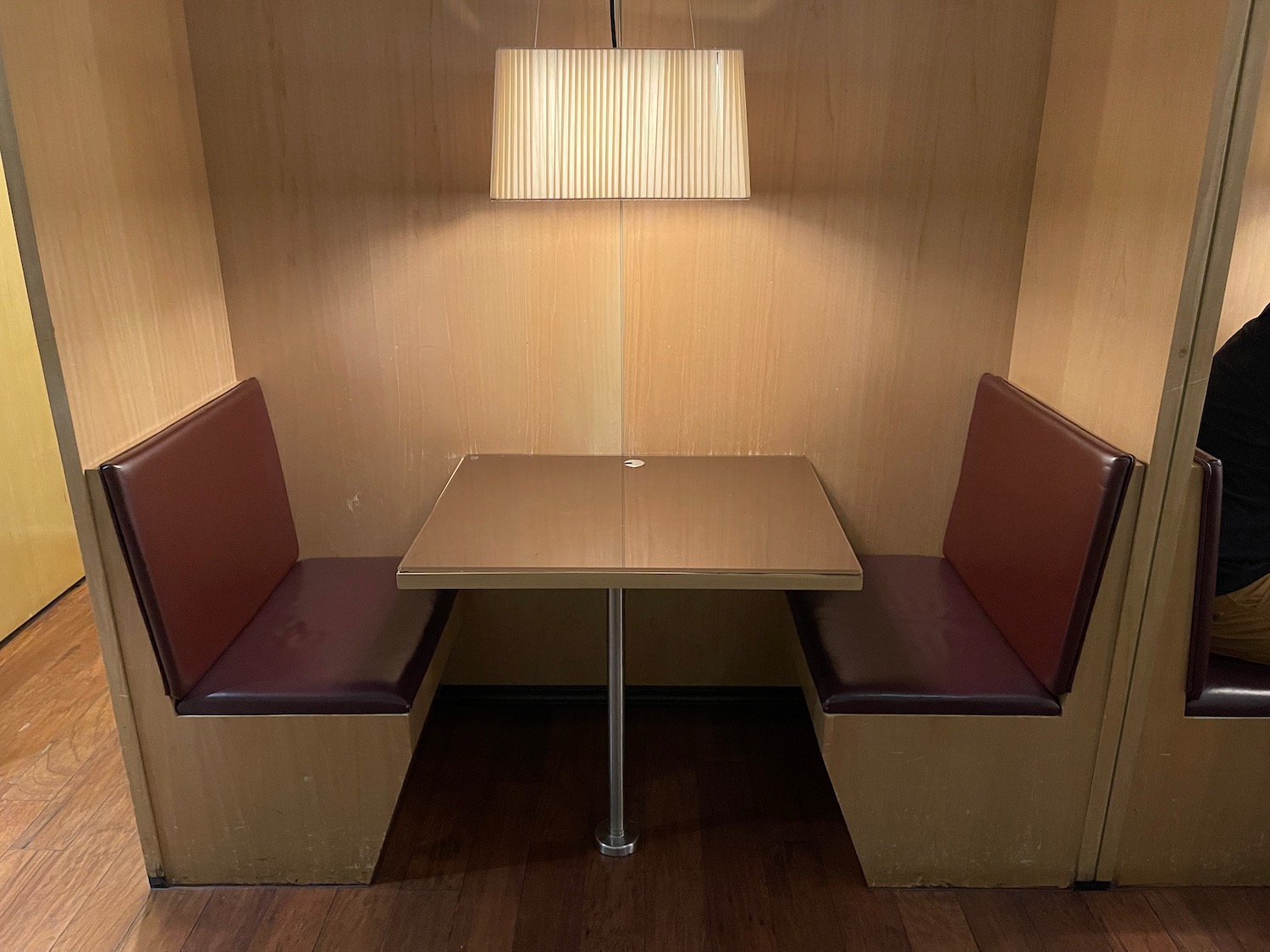 a table and chairs in a booth