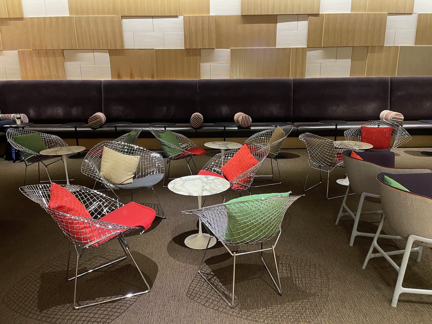 a group of chairs and tables in a room