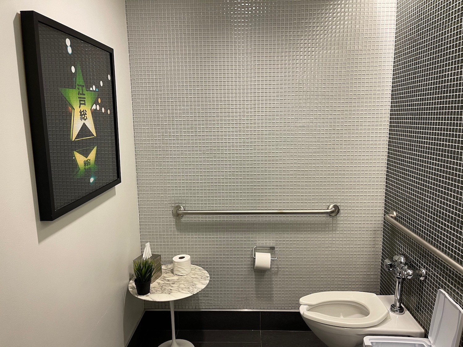 a bathroom with a toilet and a table