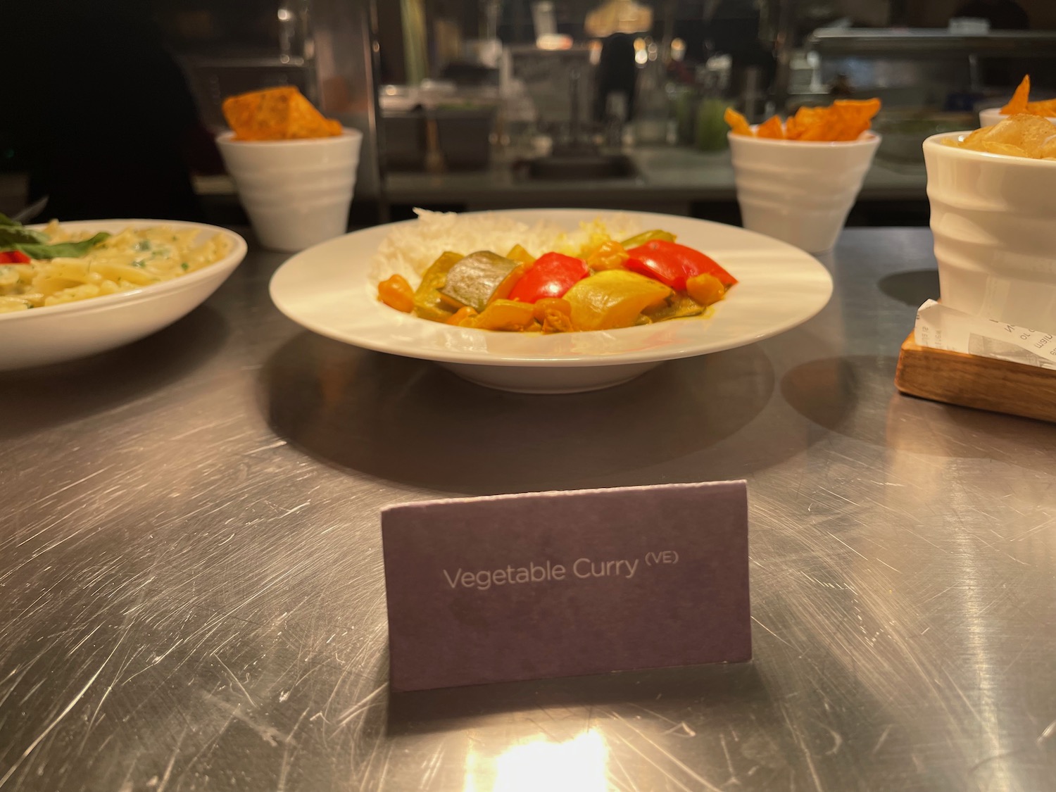 a plate of vegetables and rice on a table