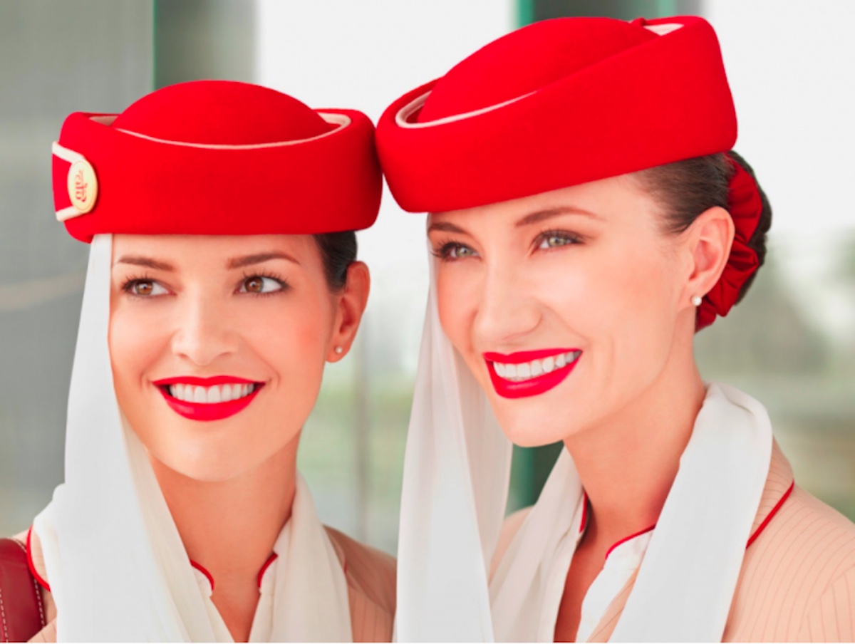 a couple of women wearing red hats
