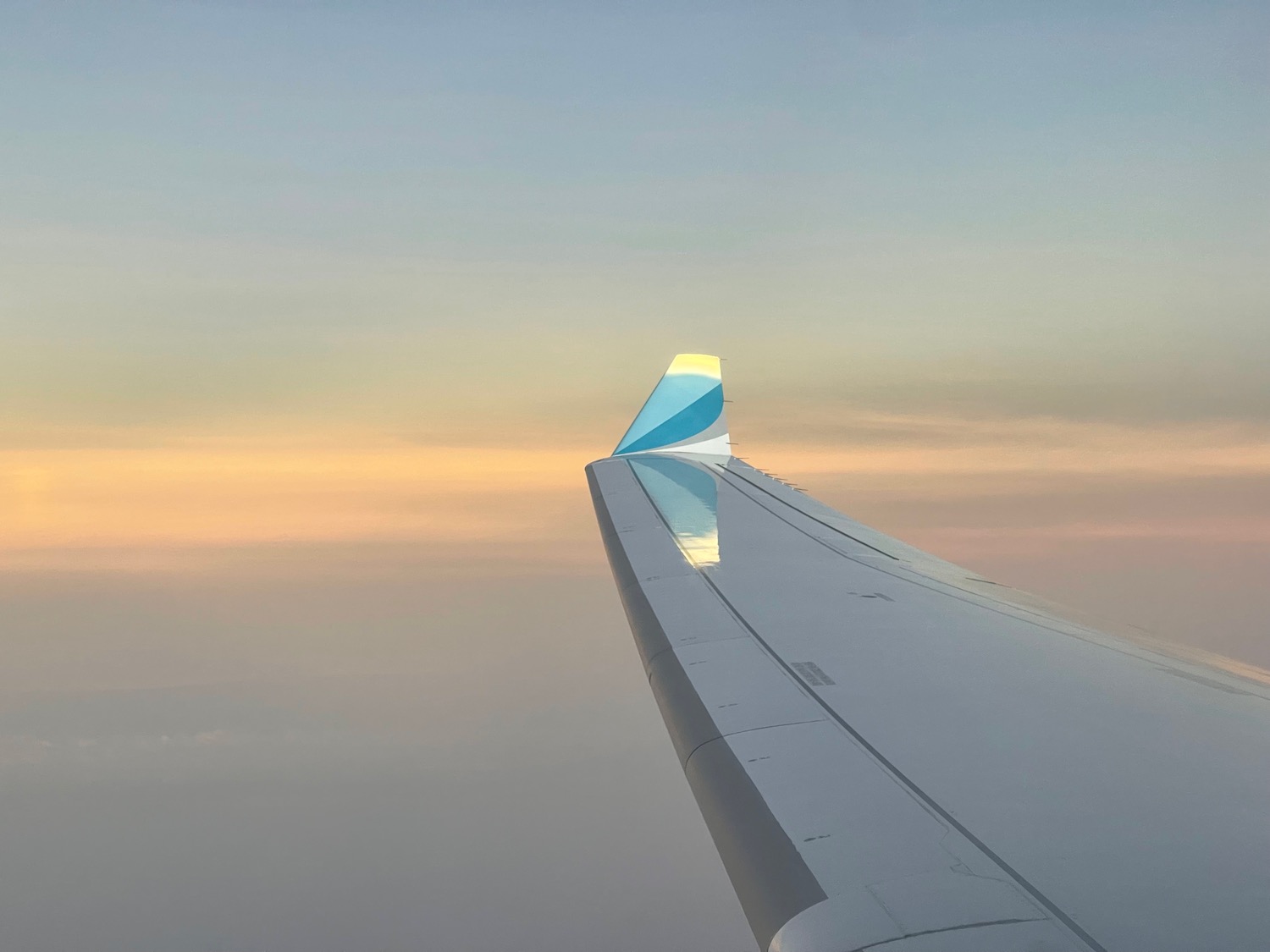 an airplane wing in the sky