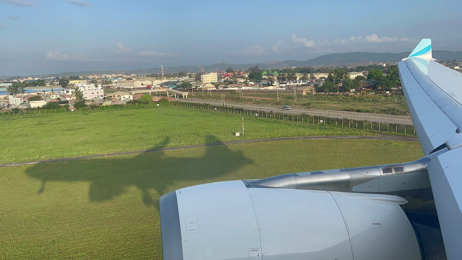 an airplane wing and a field