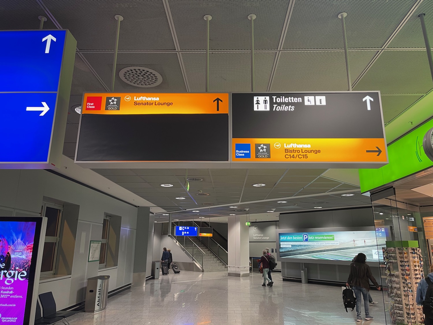 a group of people walking in an airport