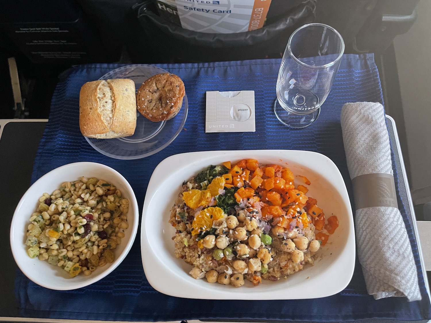 a plate of food and a napkin on a table