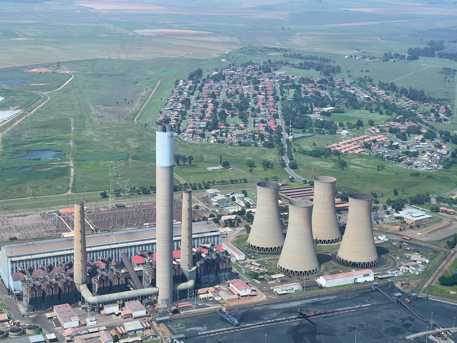 a large factory with smoke stacks