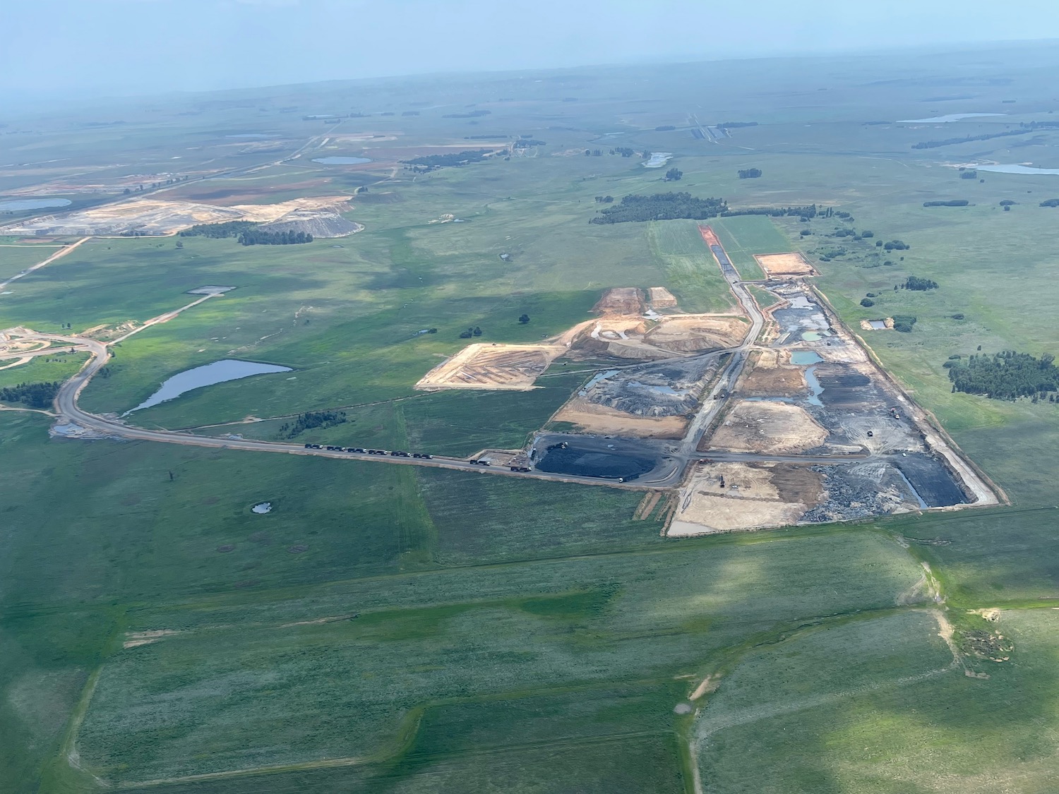 an aerial view of a large green field