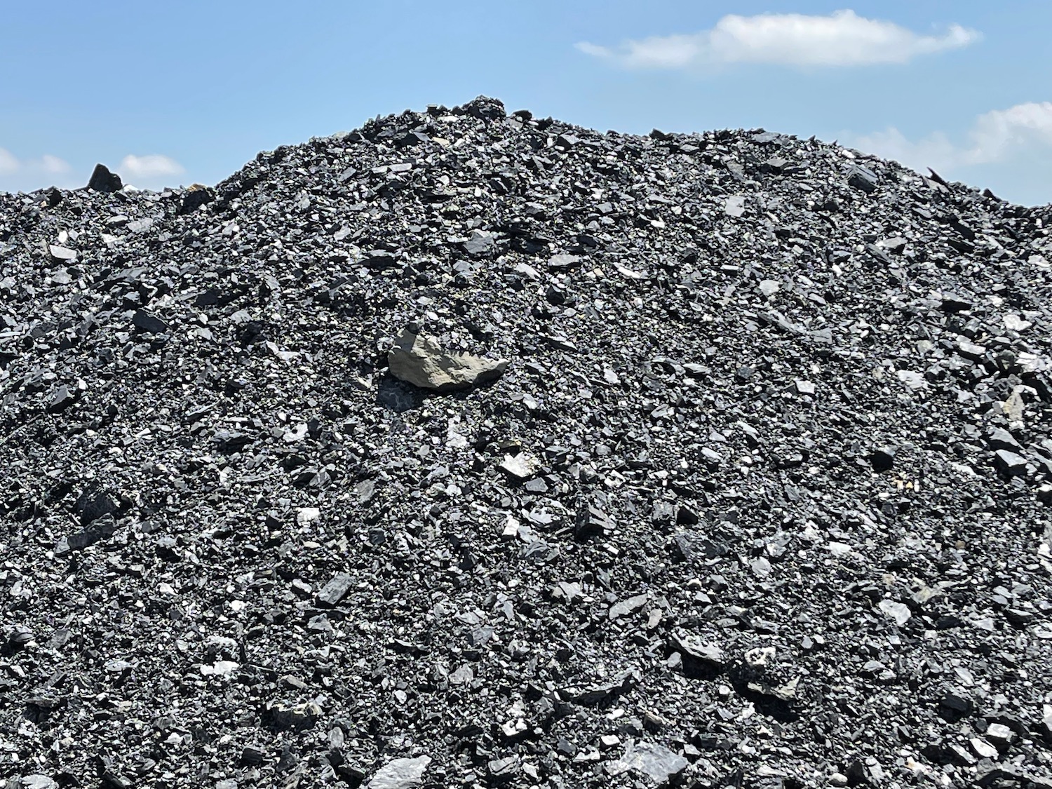 a pile of rocks and blue sky