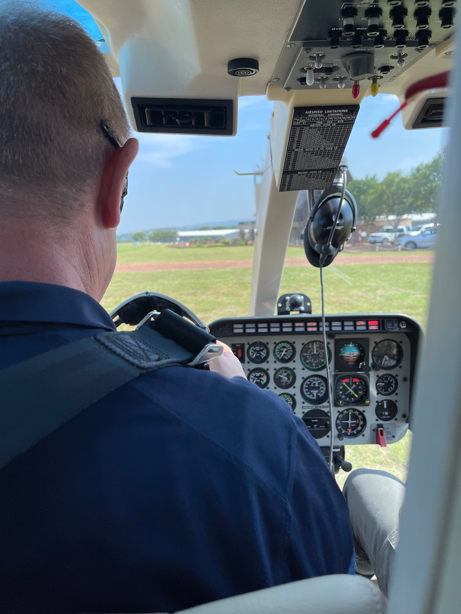 a man in a cockpit of a plane