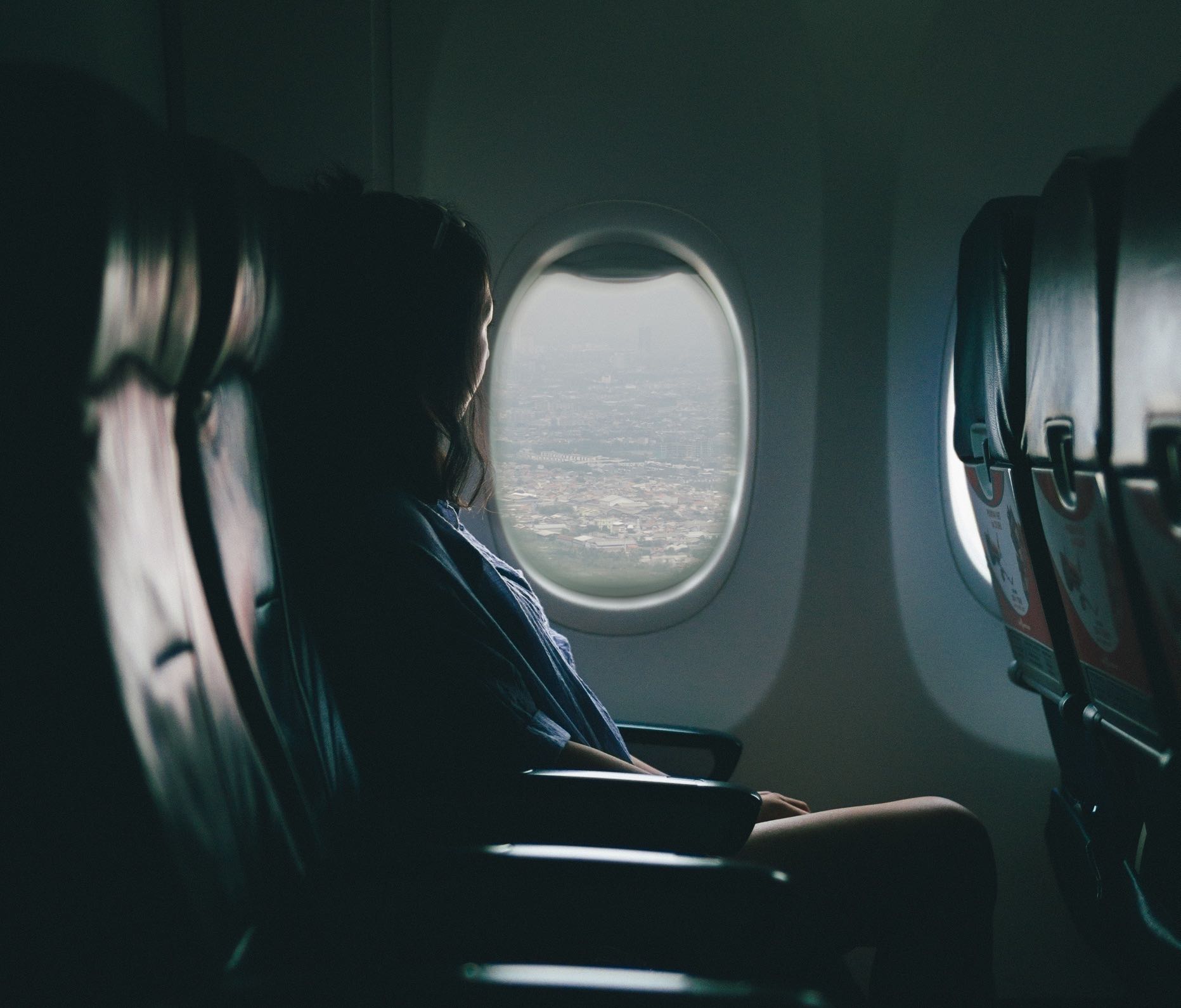 a woman sitting in an airplane