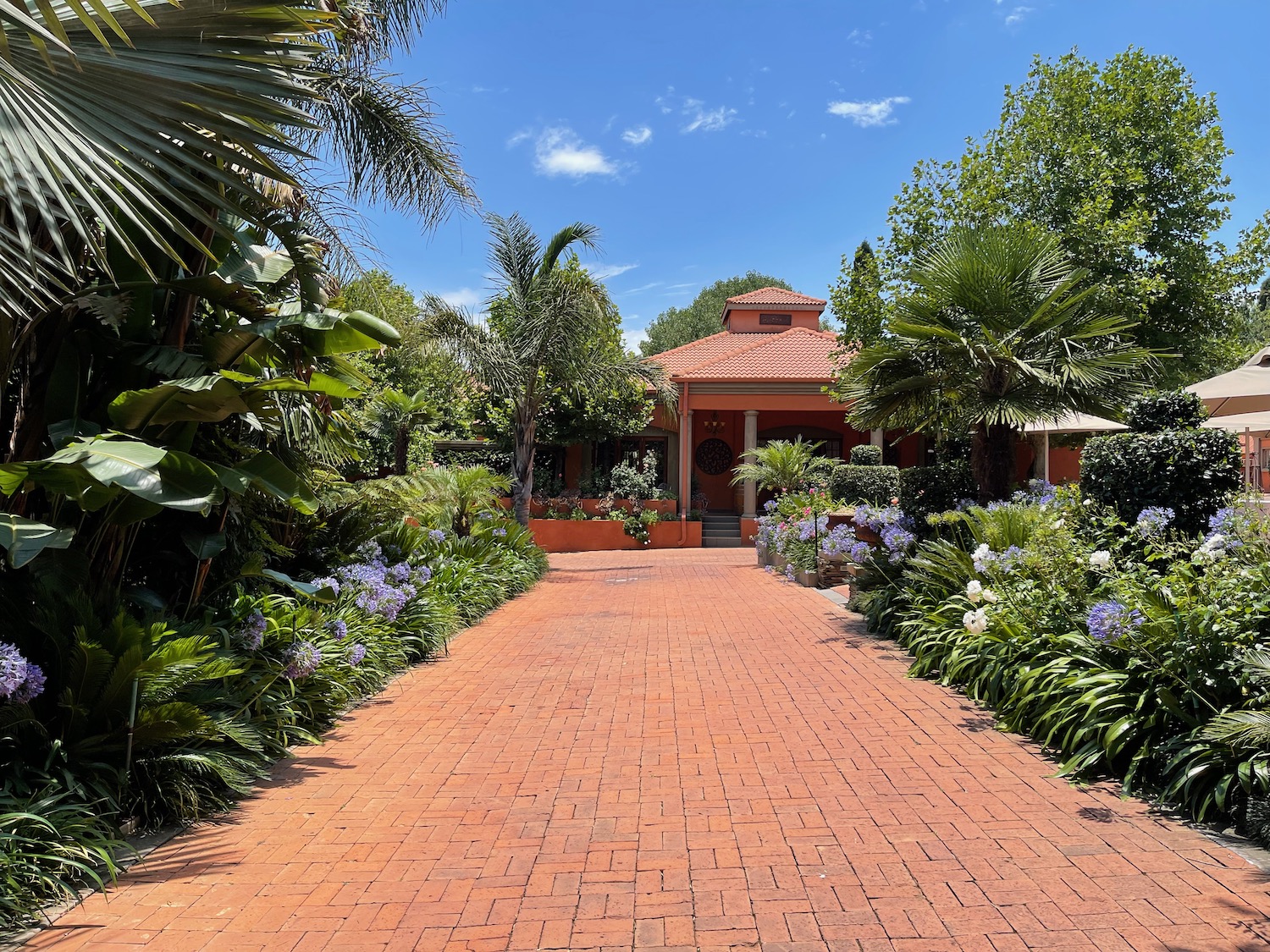 a brick path leading to a house