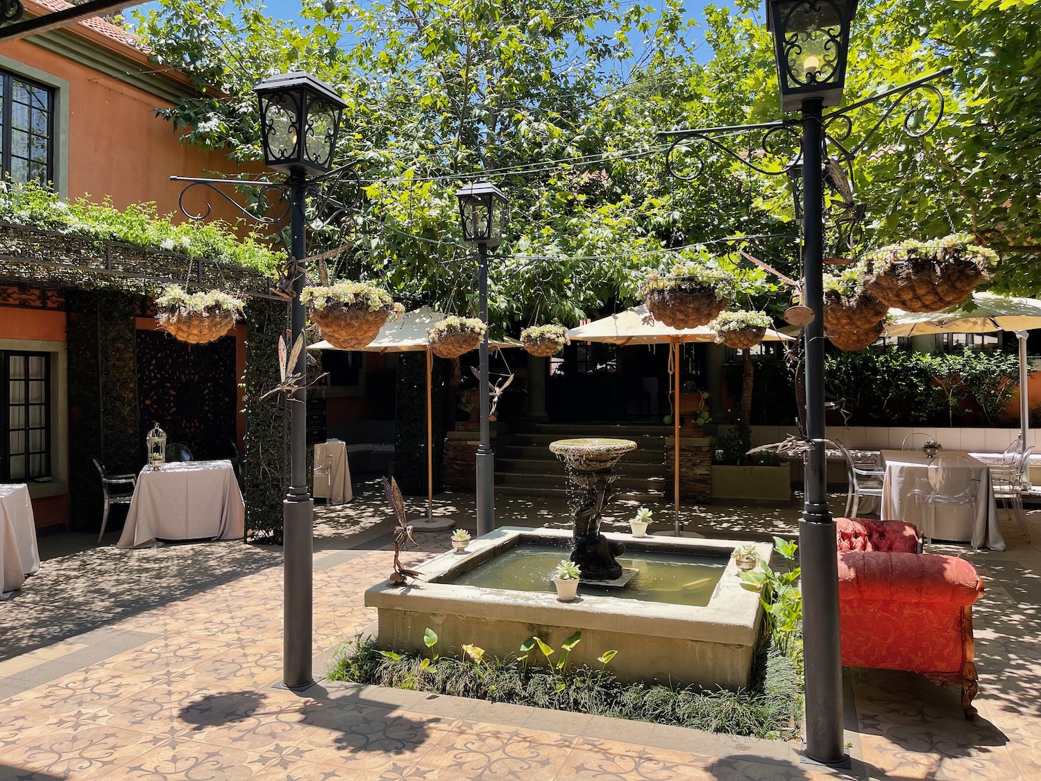 a fountain with a fountain and baskets