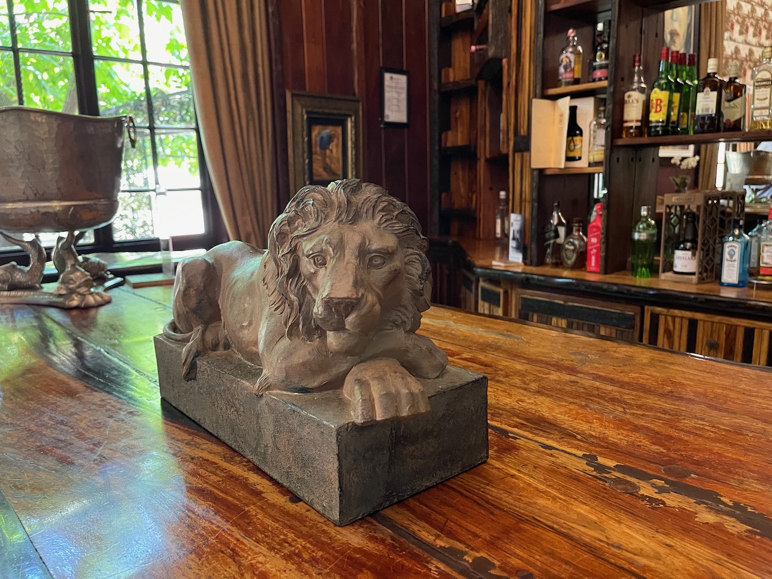 a statue of a lion on a bar counter