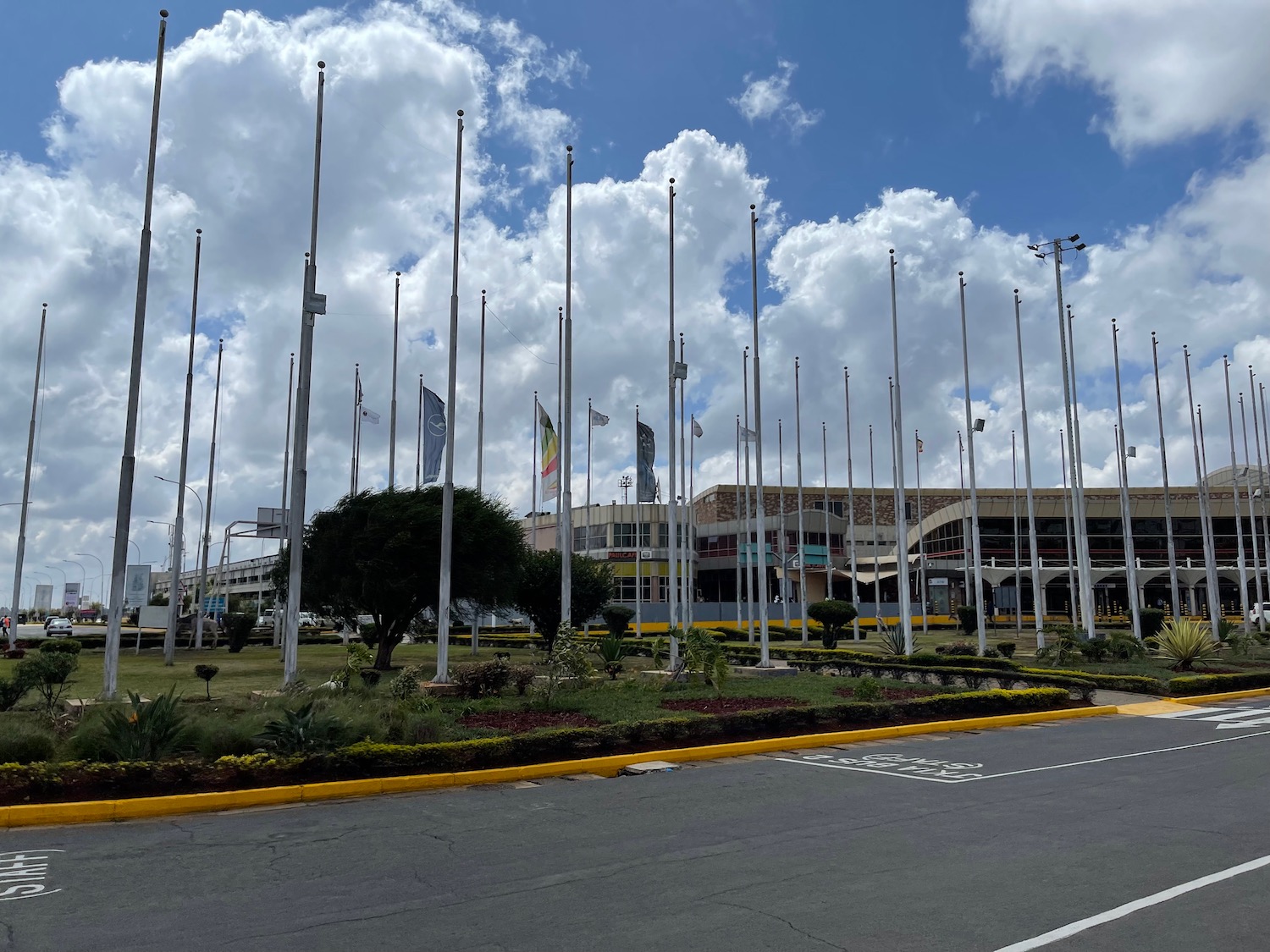 a building with flags on poles