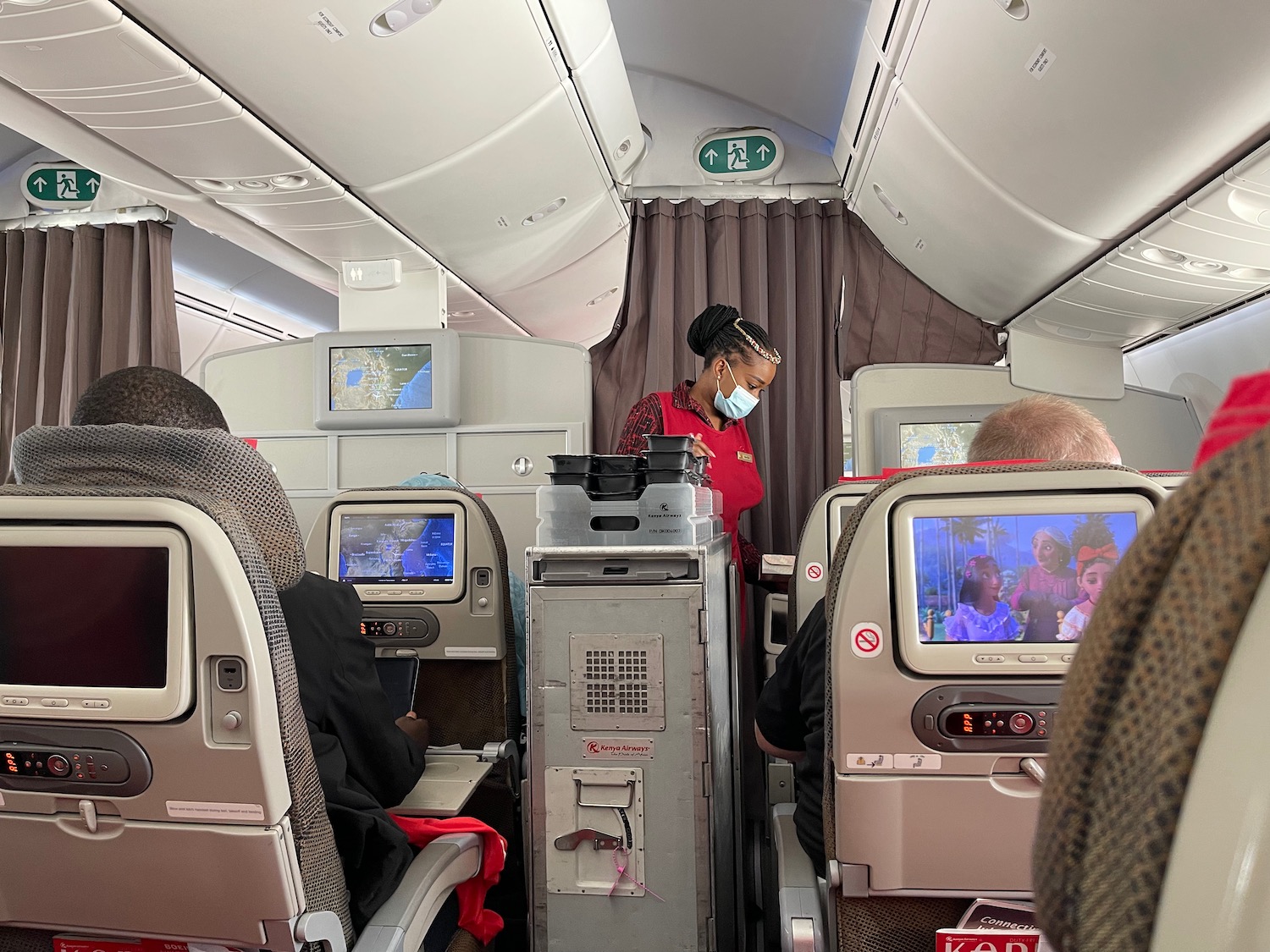 a woman wearing a mask in an airplane