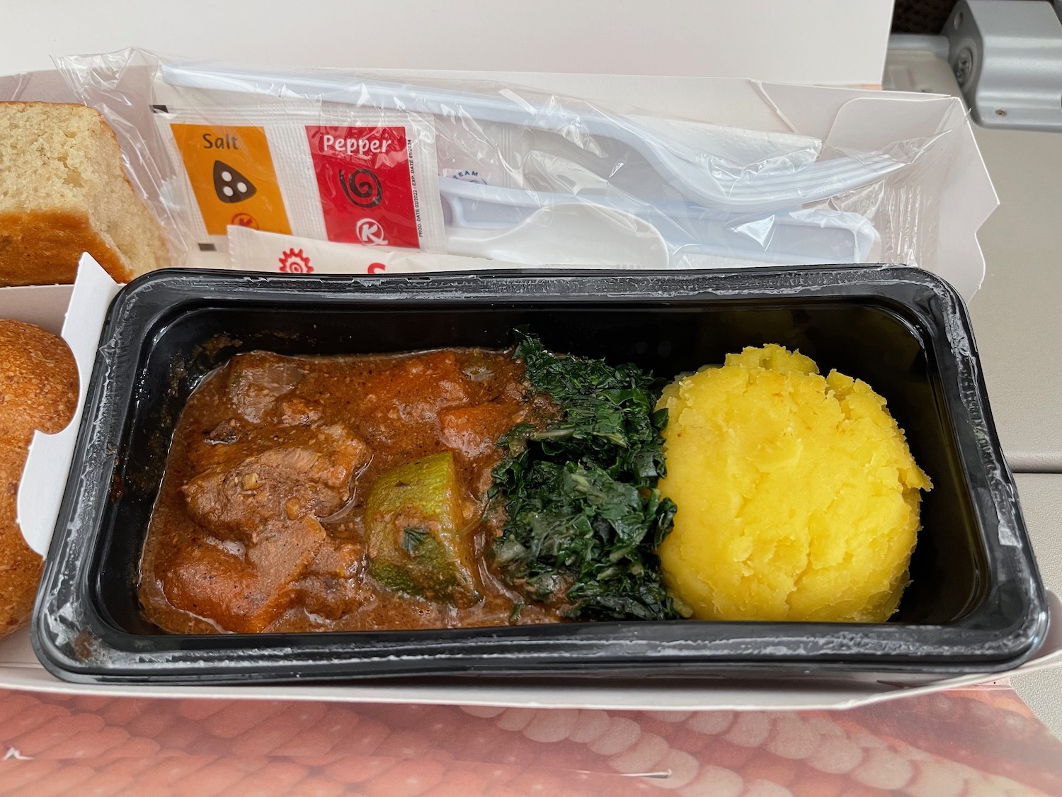 a black container with food in it