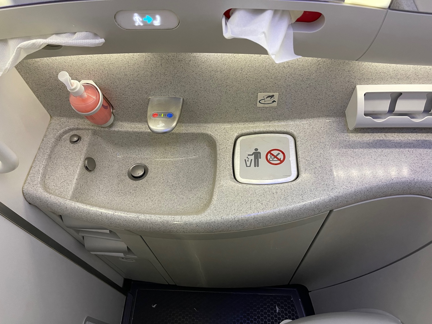a sink and a seat in an airplane