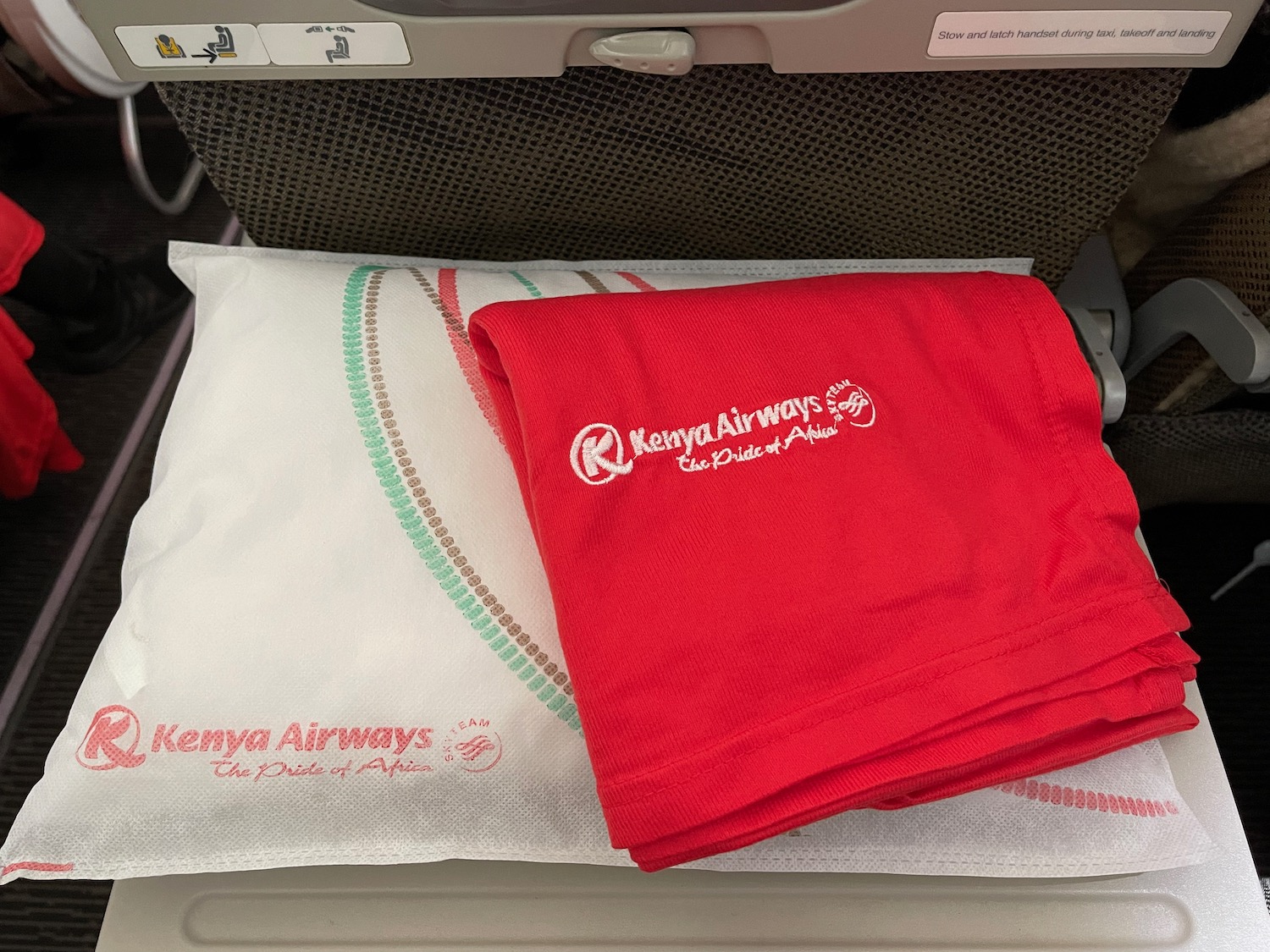 a red and white towels on a white pillow