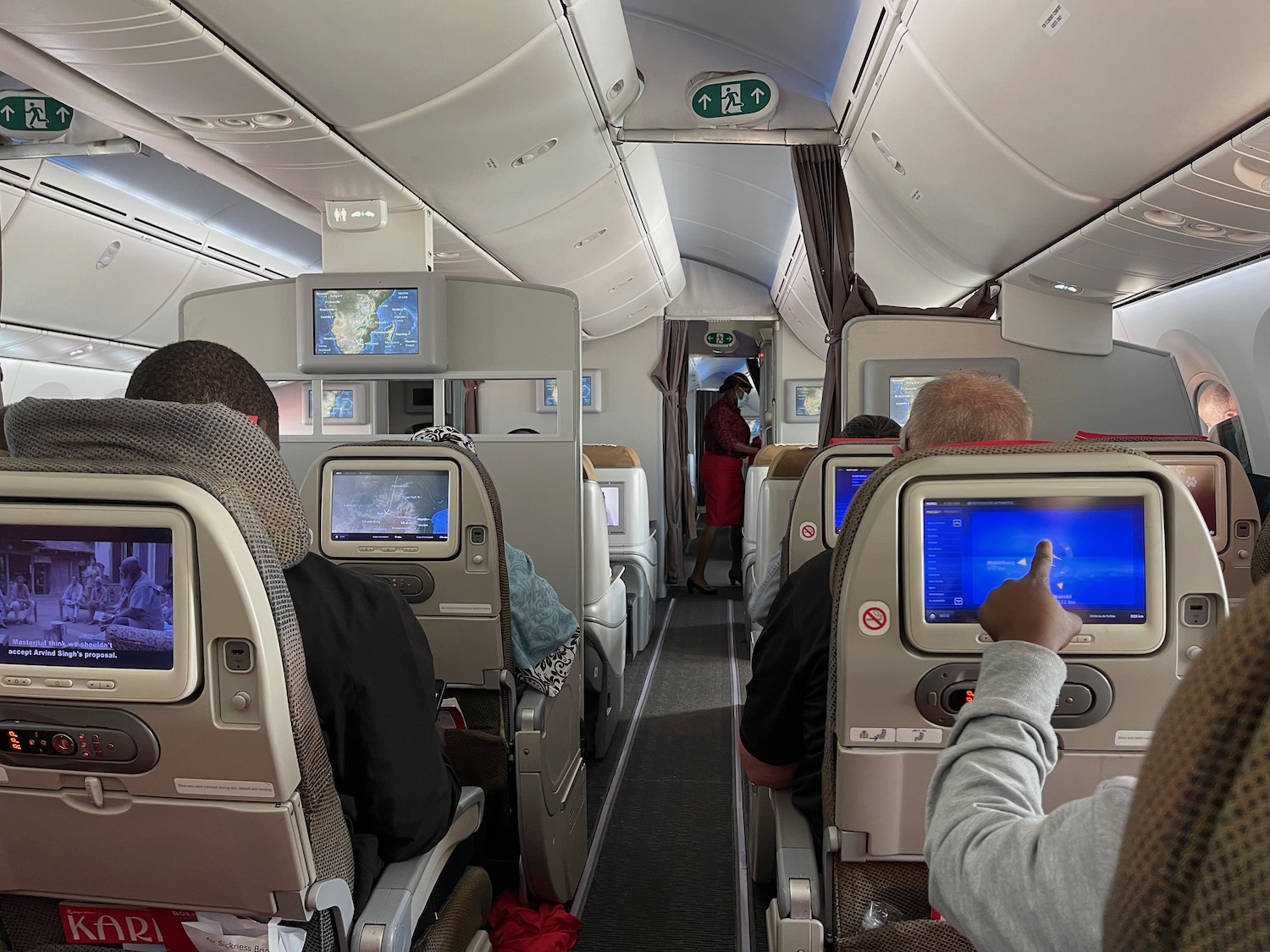 a group of people sitting in an airplane