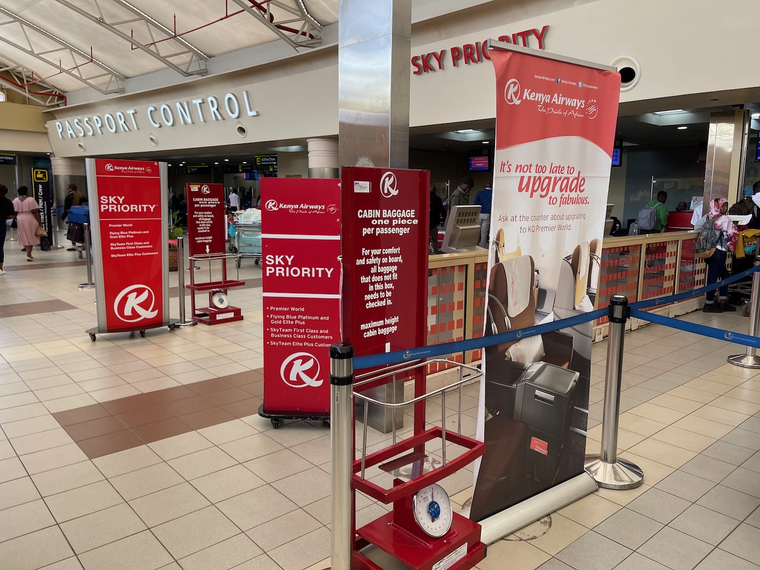 a red and white sign in a airport