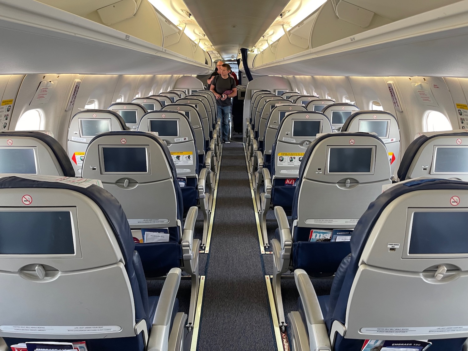a person standing in the middle of an airplane