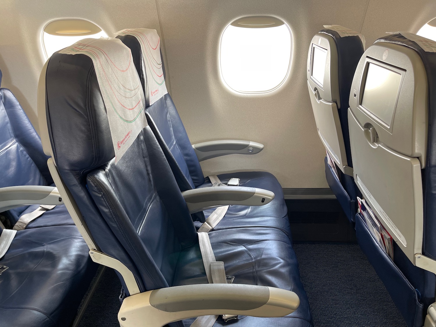 seats in an airplane with a window