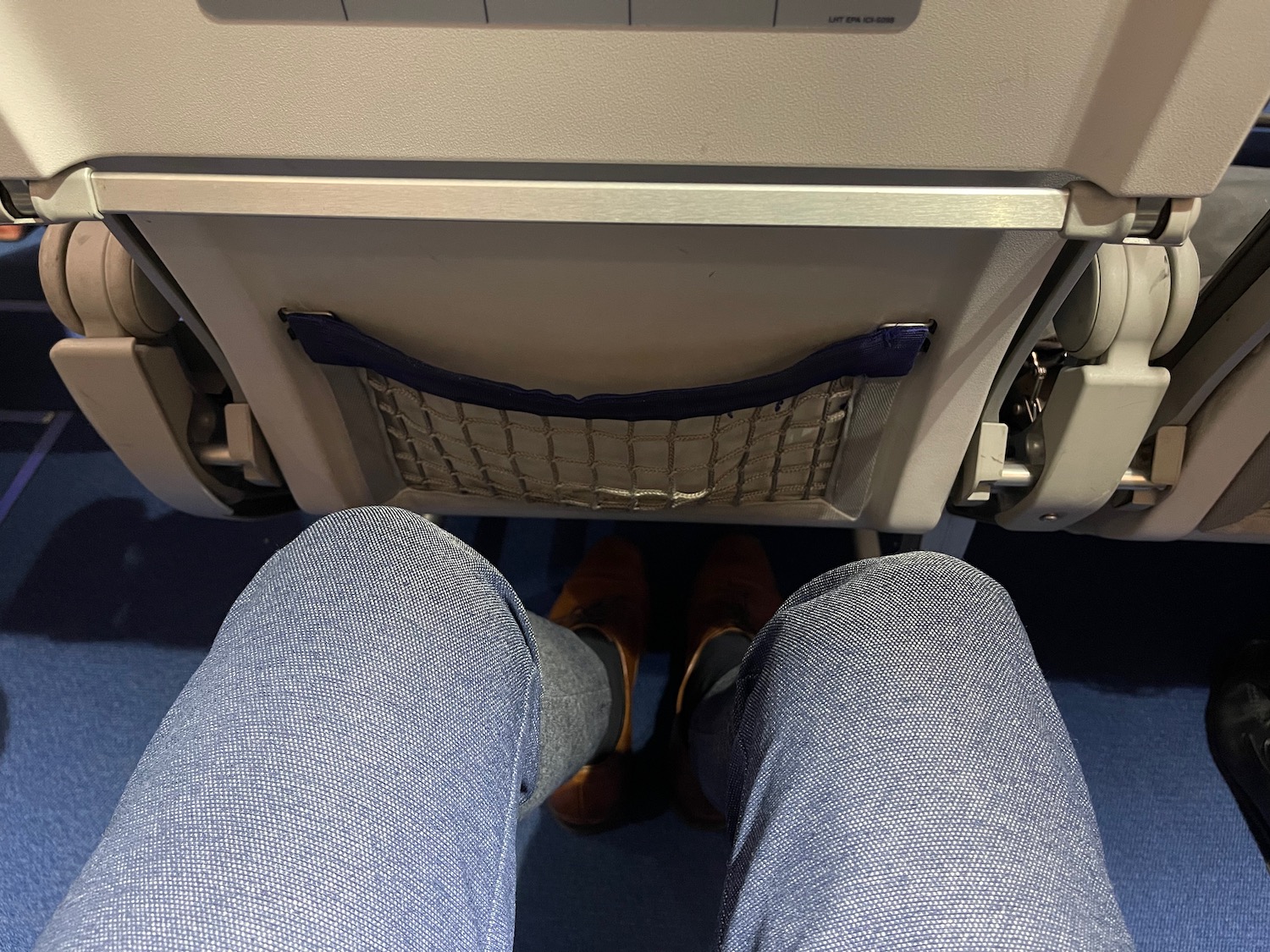 a person's legs in a seat