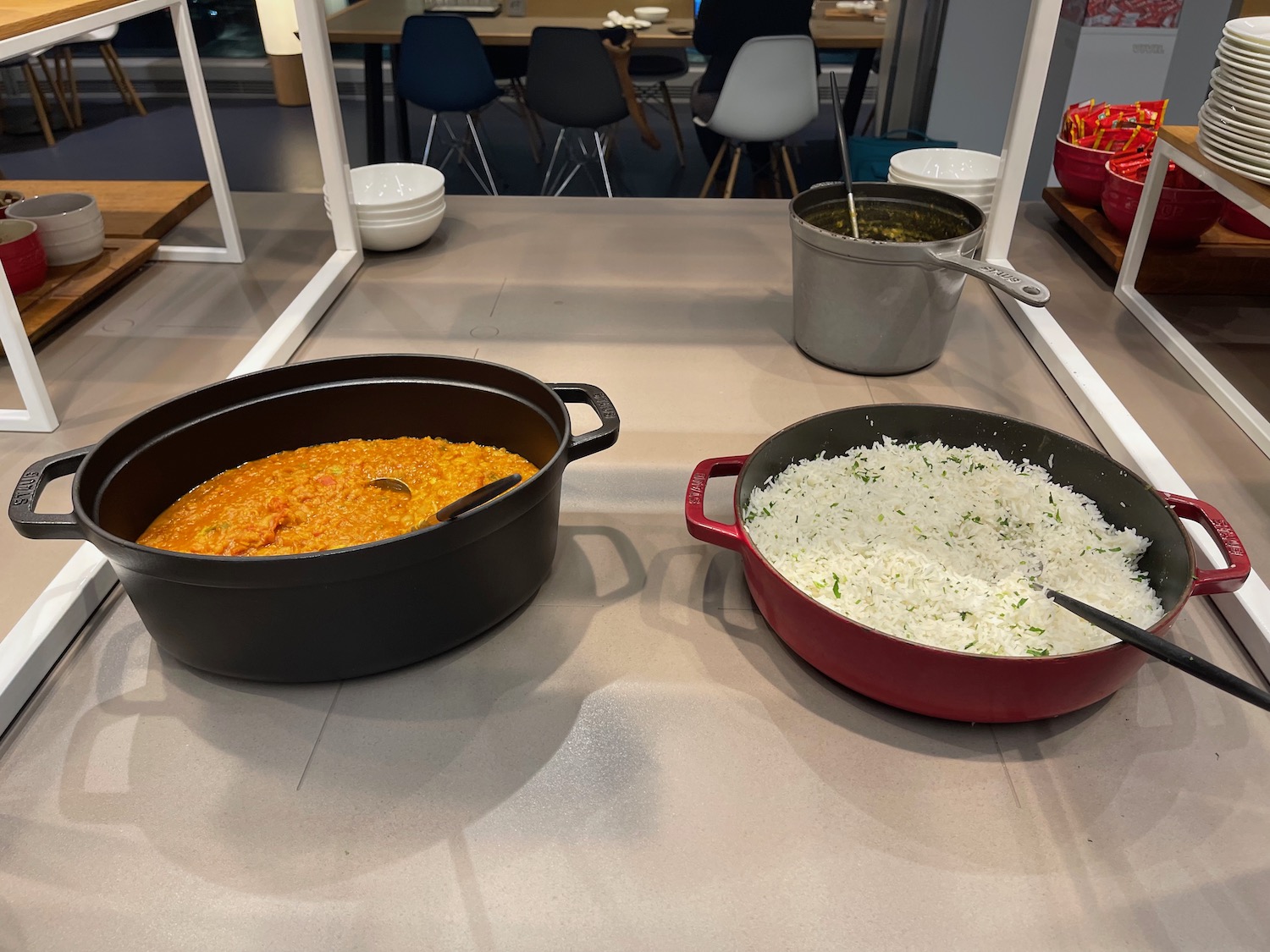 a group of pots with food in them