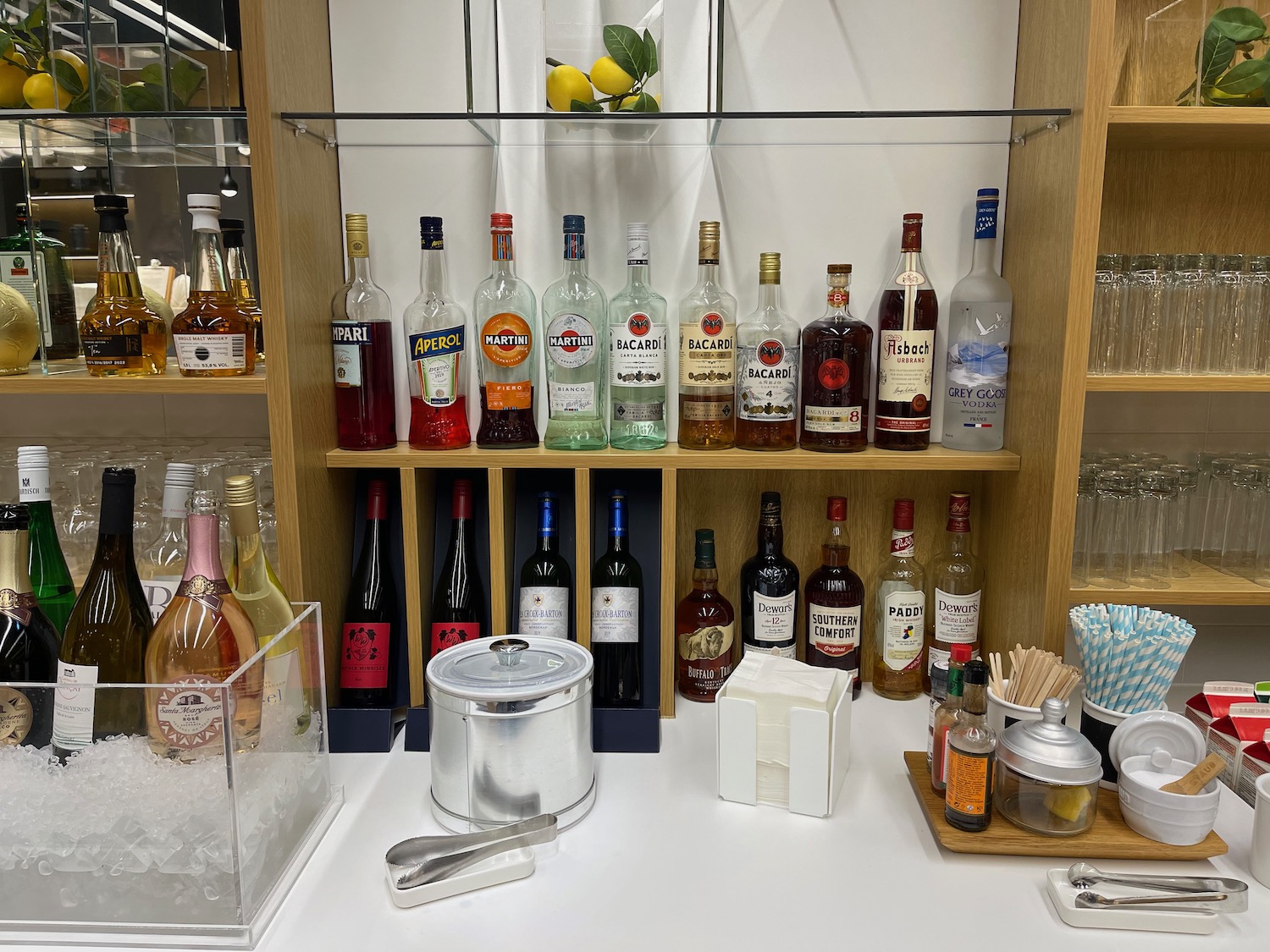 a shelf with bottles of alcohol