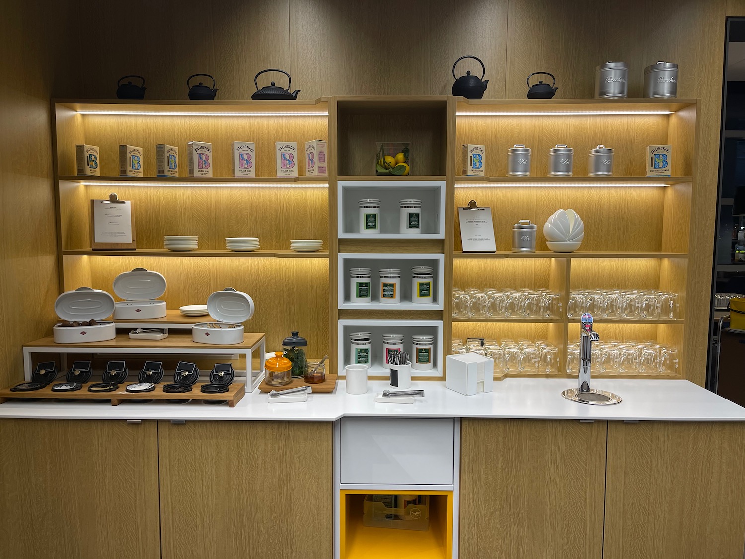 a counter with shelves and utensils