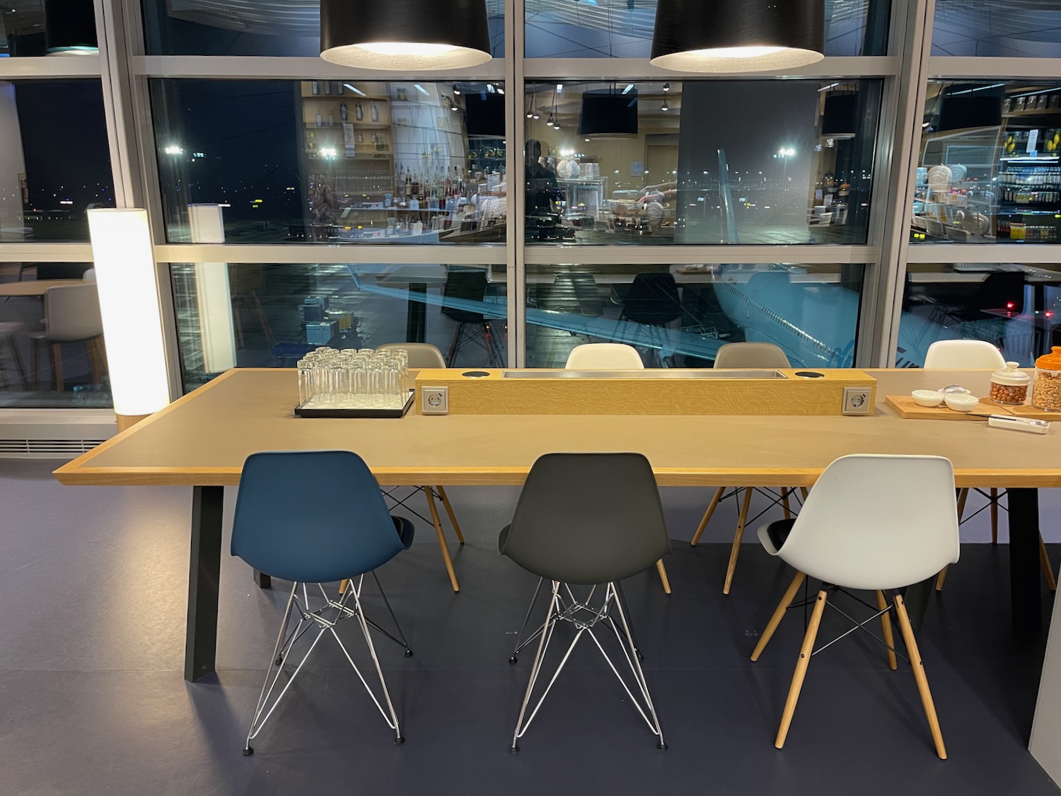 a table with chairs and a window