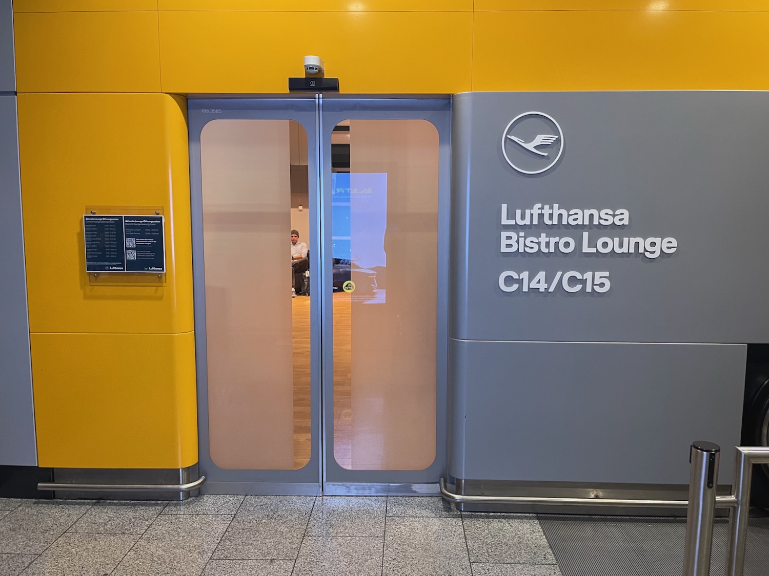 a yellow and grey door with glass panels