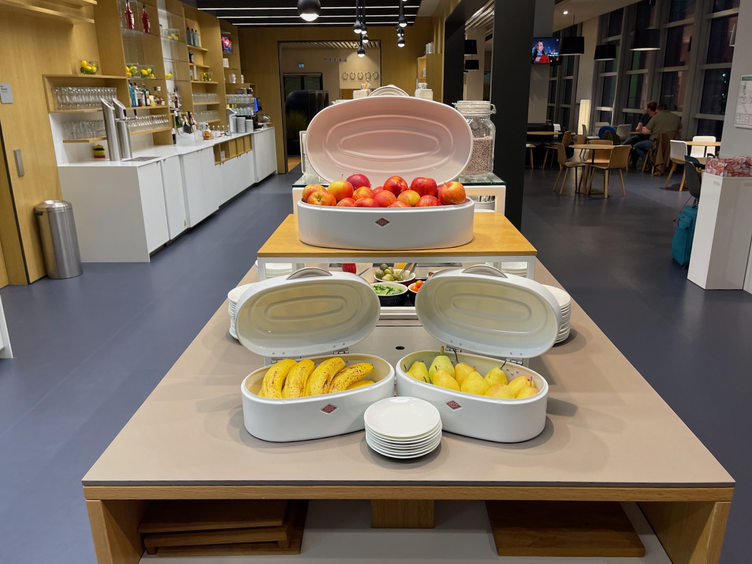 a table with fruit and plates on it