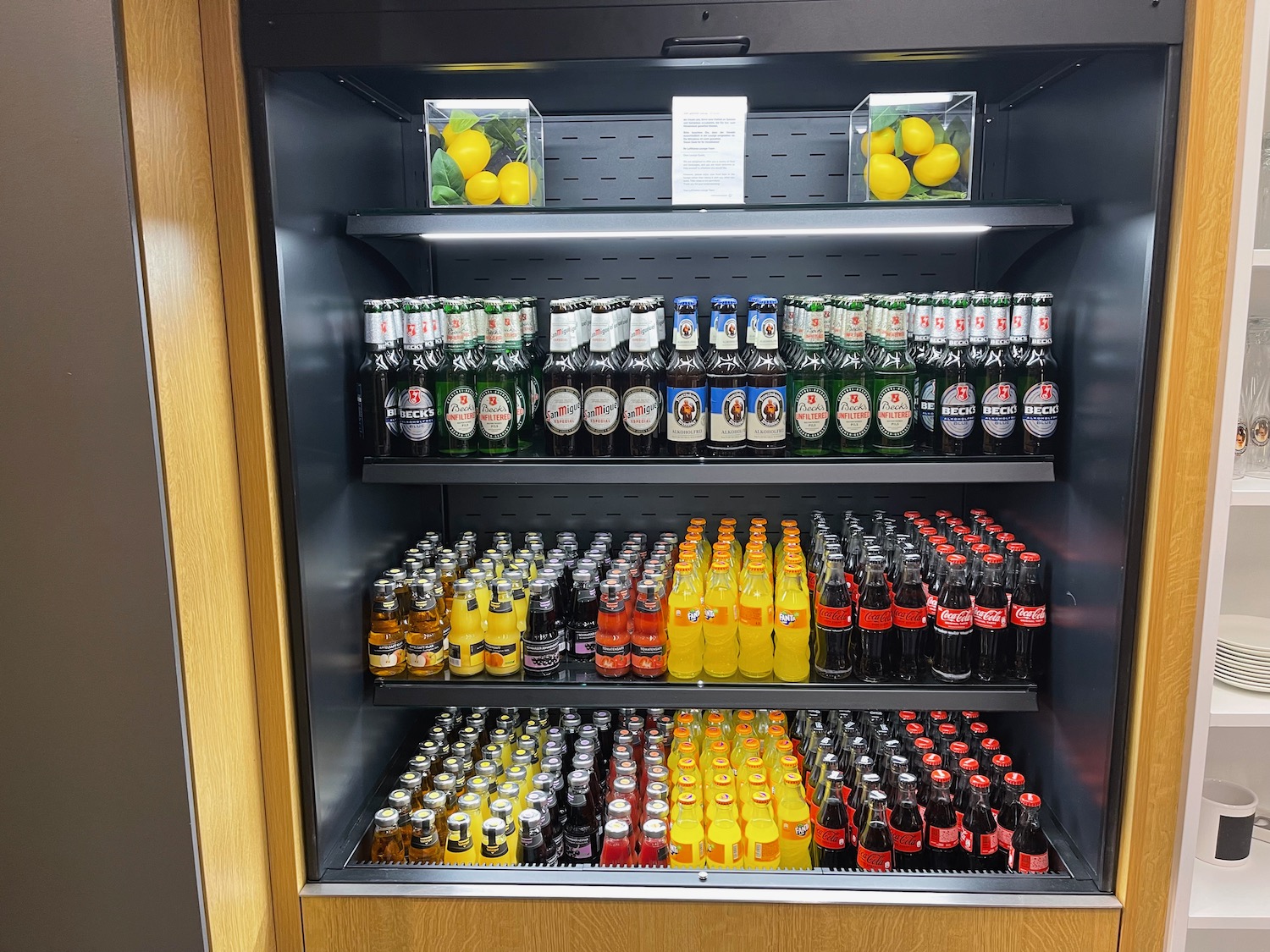 a shelf of drinks on a shelf