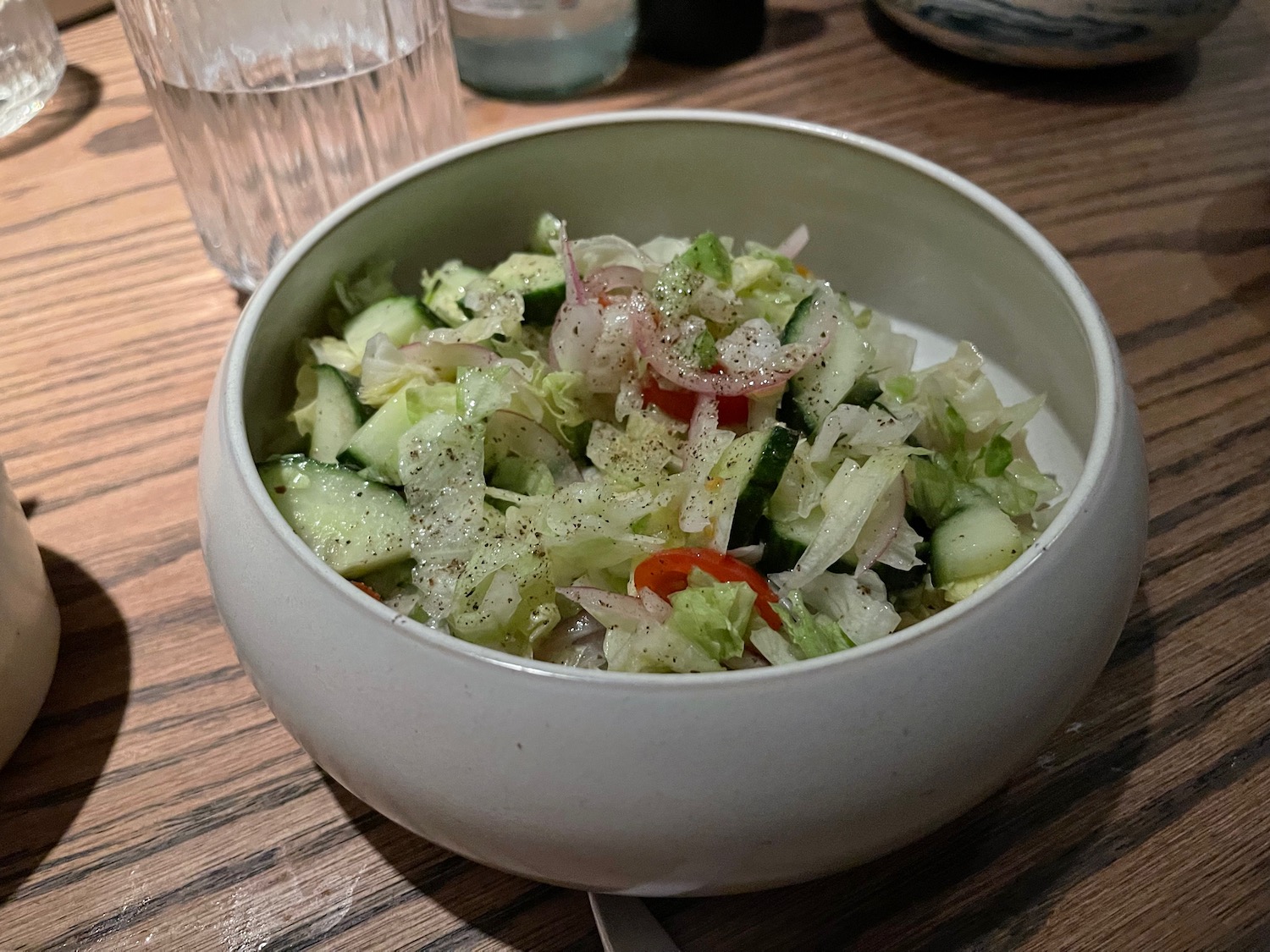 a bowl of salad on a table