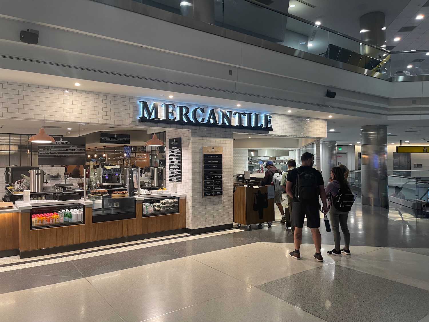 people standing in front of a restaurant